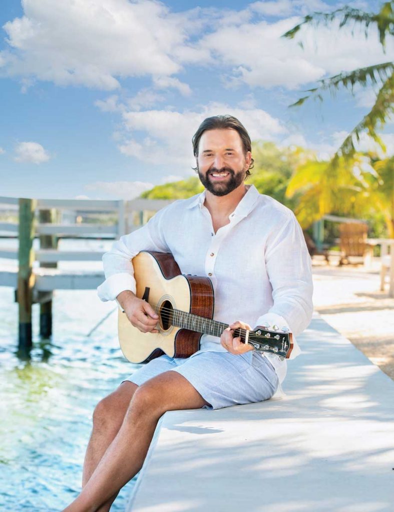 A man and his guitar. Photography by Tracey Benson