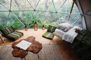 Accommodation choices include custom geodesic domes. Courtesy of ChoZen Retreat