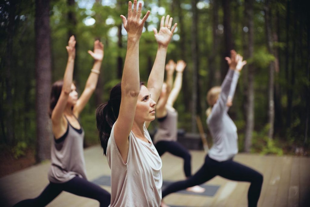 Outdoor yoga in the woods. Photo courtesy Blackberry Farm
