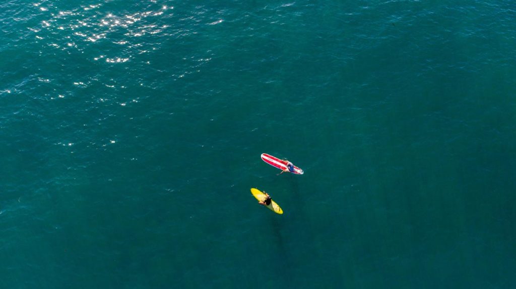 Surfing. Photo by Daniel McCullough via Unsplash