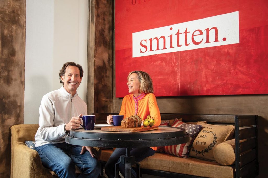 Ross Holland and Randi Kaye enjoying a moment in their breakfast nook (painting by Holland, 2020). Photo by Benjamin Rusnak