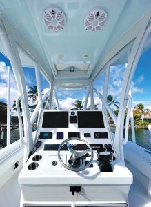 Custom design changes include a recessed electronics box at the helm with a pair of flush-mounted MFD units. Photo by George LaBonte