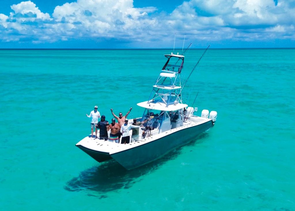 Mike Rendina in the Bahamas with friends. Photo by Ryan Wolf