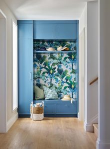 A bold floral wallpaper adds character to the mudroom. Photo by Carmel Brantley