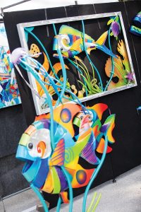 ArtiGras features a juried exhibition of outstanding fine art and activities that include live entertainment, culinary showcases, artist demonstrations, interactive art activities for all ages, and a youth art competition. Photo courtesy of Palm Beach North Chamber of Commerce