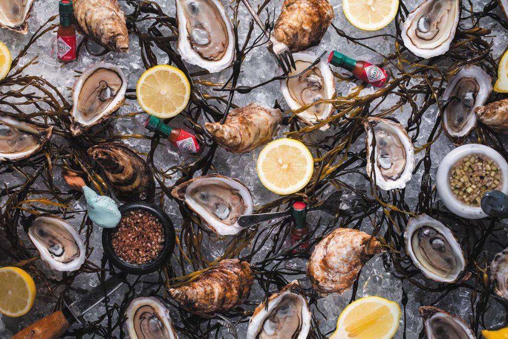 Lucky Shuck Oyster Bar & Taphouse will host the sixth annual South Florida’s Shucking Best Oyster Eating Contest August 5. Photo by Libby Vision