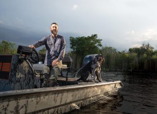 Swamp Things with Python Cowboy Mike Kimmel Mike Kimmel and Uzi in the Everglades. Photo by Steven Martine