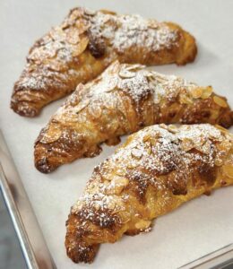 A flaky almond croissant. Photo by EatPalmBeach