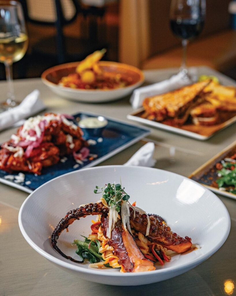 A colorful spread starring grilled octopus with kimchi and miso-yuzu glaze. Photo courtesy of Little Moir's Sweet Fish