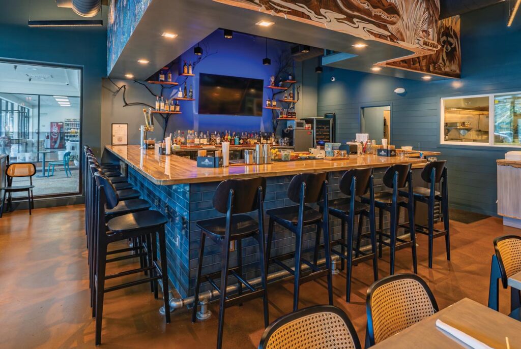 The lively bar and open-line kitchen at Sweet Fish. Photo courtesy of Little Moir's Sweet Fish
